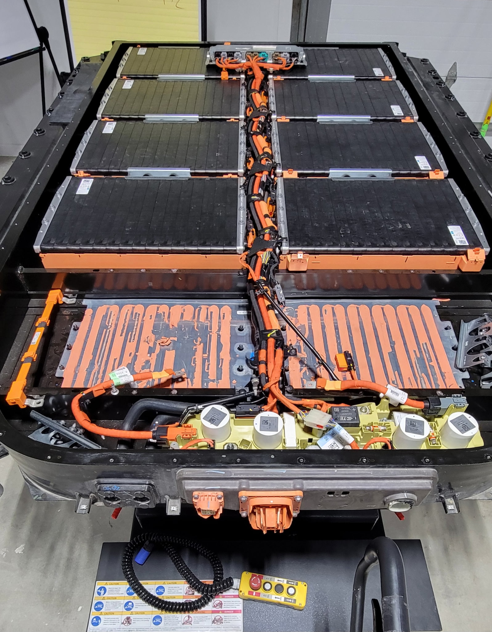 ESA technician performing high-voltage EV service work